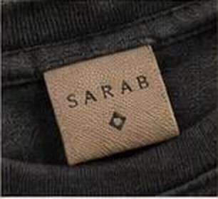 Woven neck label reading SARAB