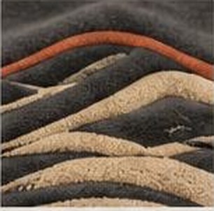 Raised puff print dune lines with one terracotta line